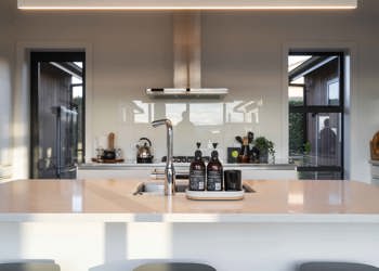 Island Bench And Stove With Crisp White Splashback